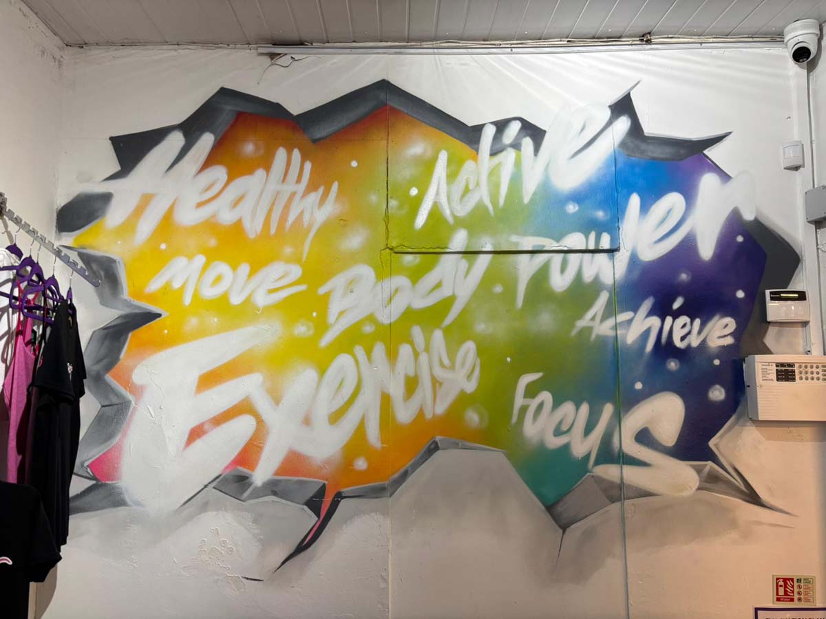 Colourful motivational graffiti artwork in the studio