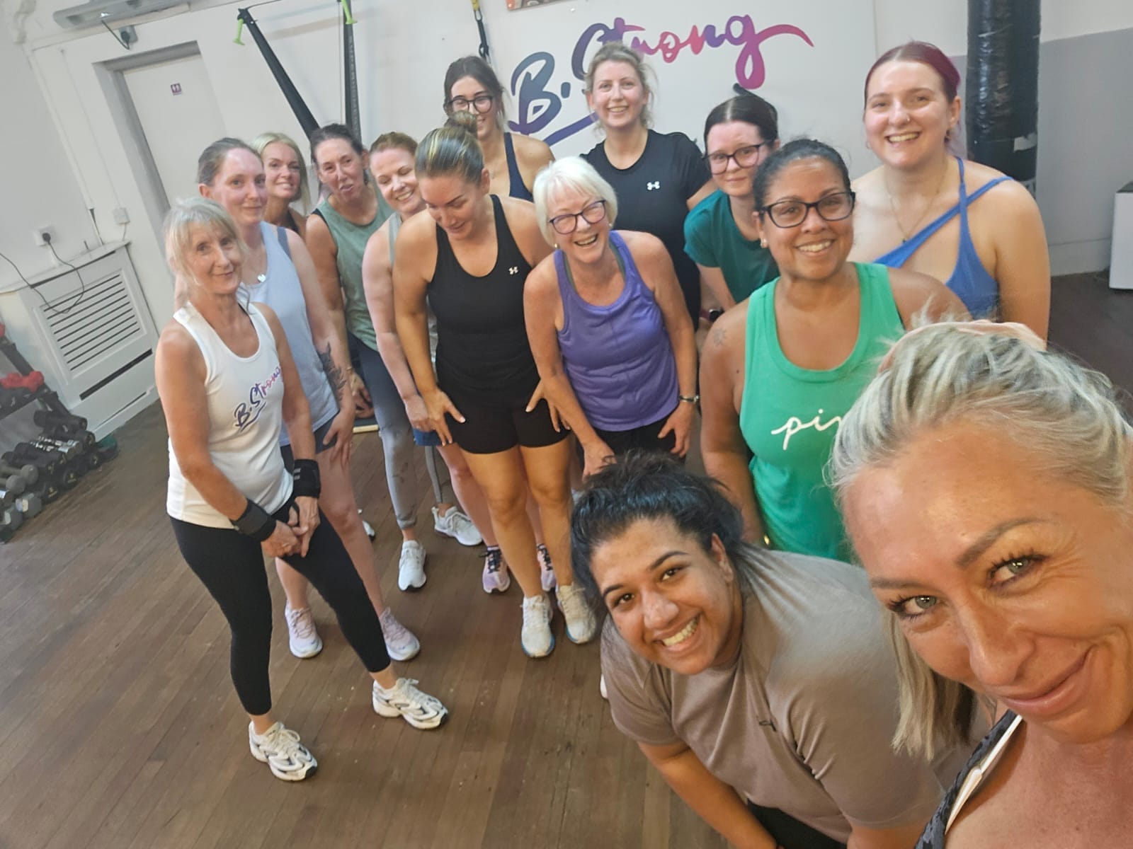 B-Strong members smiling together after a group session